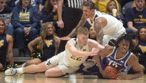 Sean McNeil rallies West Virginia to 71-68 victory over Kansas State
